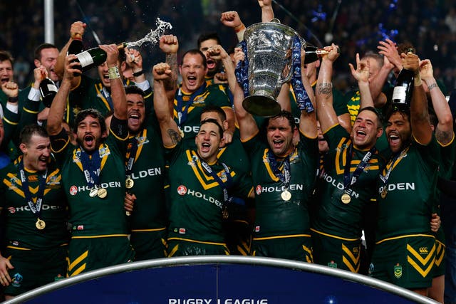 Victorious Australia players lift the World Cup at Old Trafford