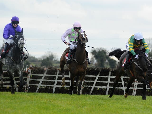 Tony McCoy riding Jezki, far right, clears the last to win The Bar One Racing Hatton’s Grace Hurdle