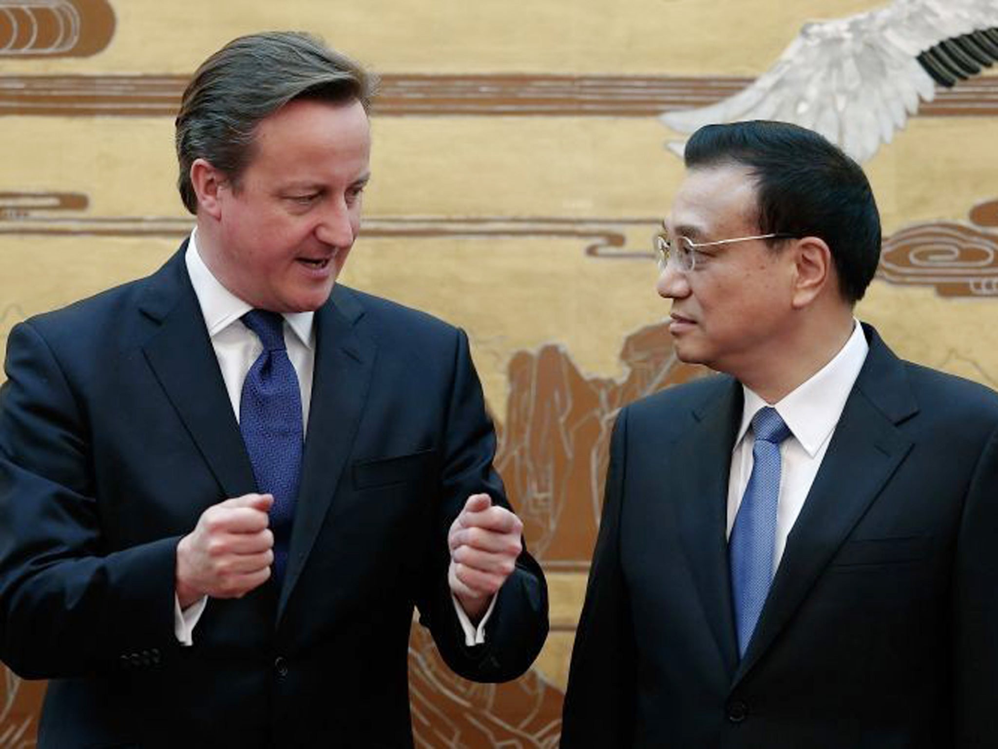 David Cameron talks with Chinese Premier Li Keqiang at the Great Hall of the People in Beijing