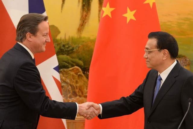 <p>David Cameron shakes hands with Li Keqiang, the former Chinese premier, in 2013 </p>