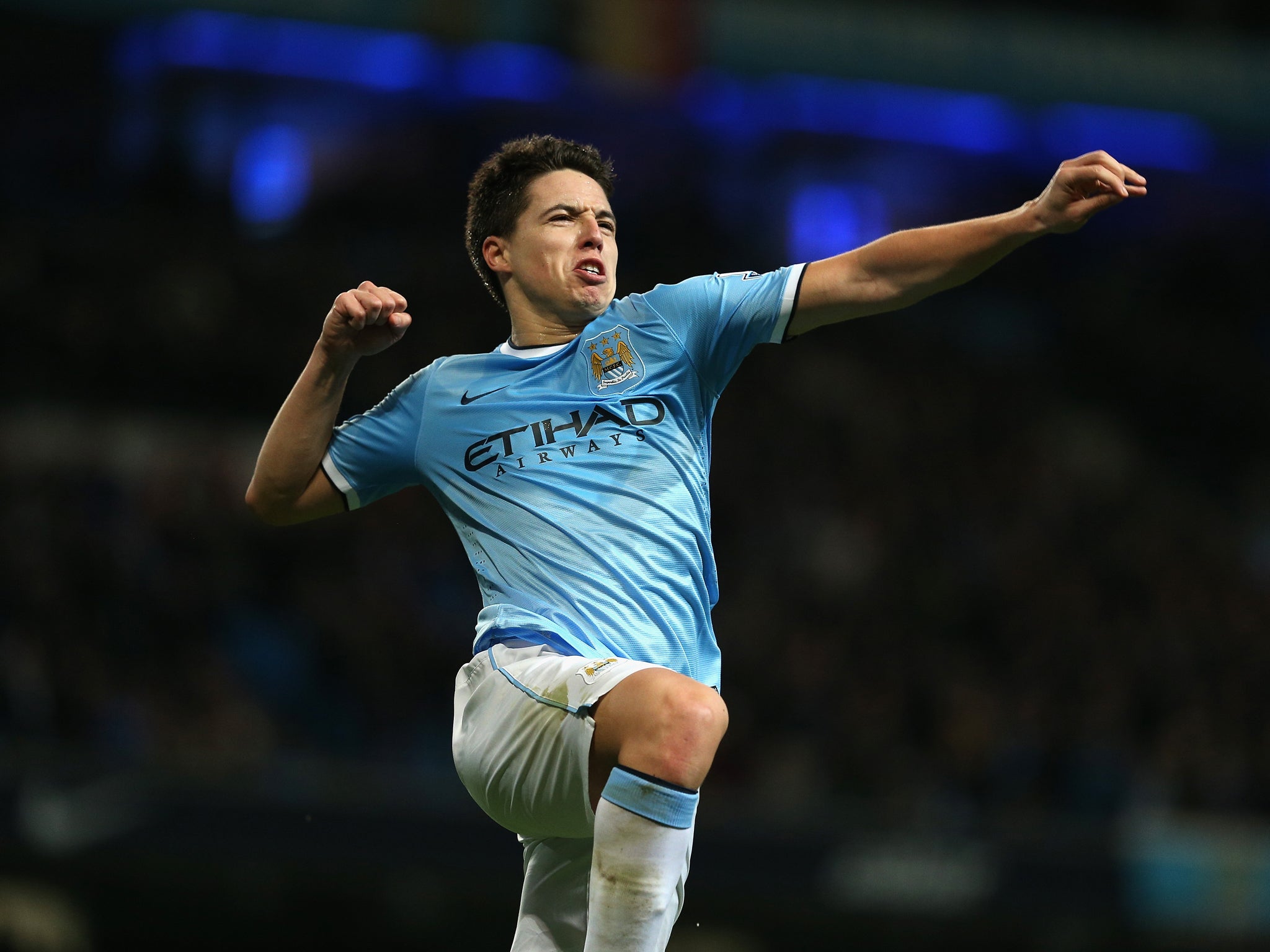 Samir Nasri has challenged Manchester City to demonstrate their brilliant home form on their travels this month to take them to the top of the Premier League