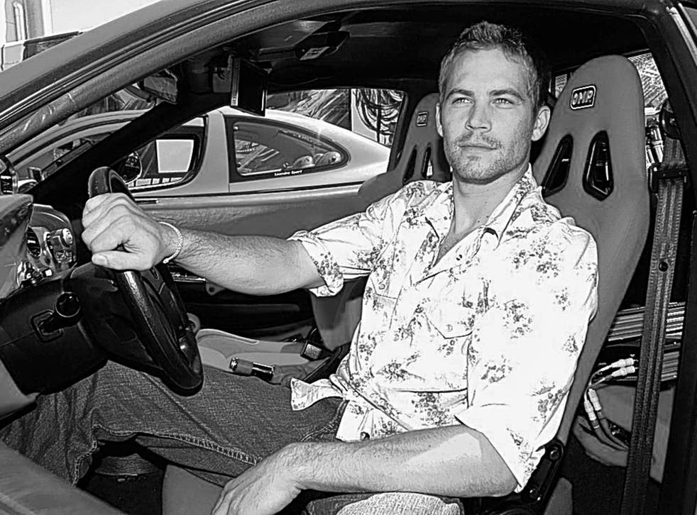 Walker in 2003 during a photoshoot to publicise the second 'Fast & Furious' film