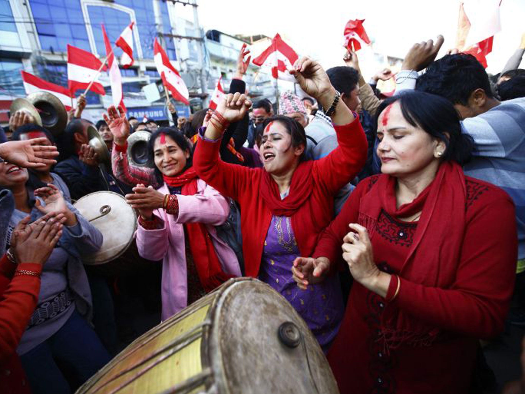 Supporters of Nepali Congress Party cheer for their party at the Constituent Assembly Elections