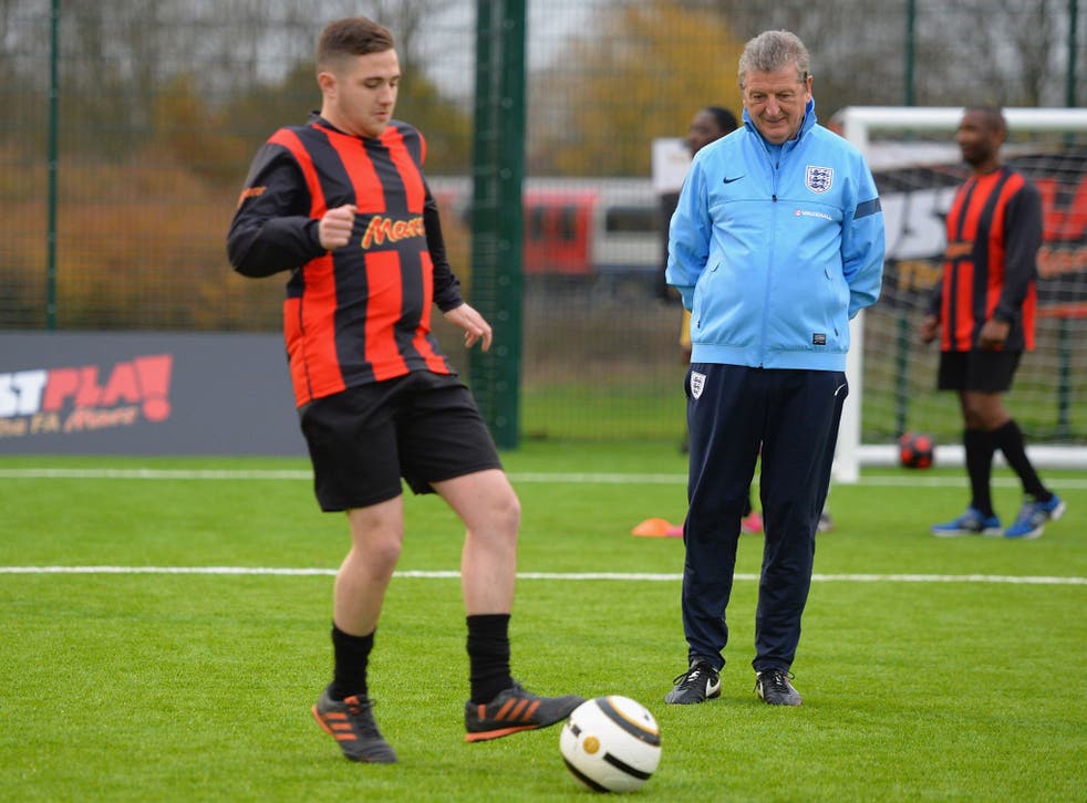 England manager Roy Hodgson oversees a training session during the relaunch of the FA and Mars partnership at Lord Halsbury playing fields in Northolt 
