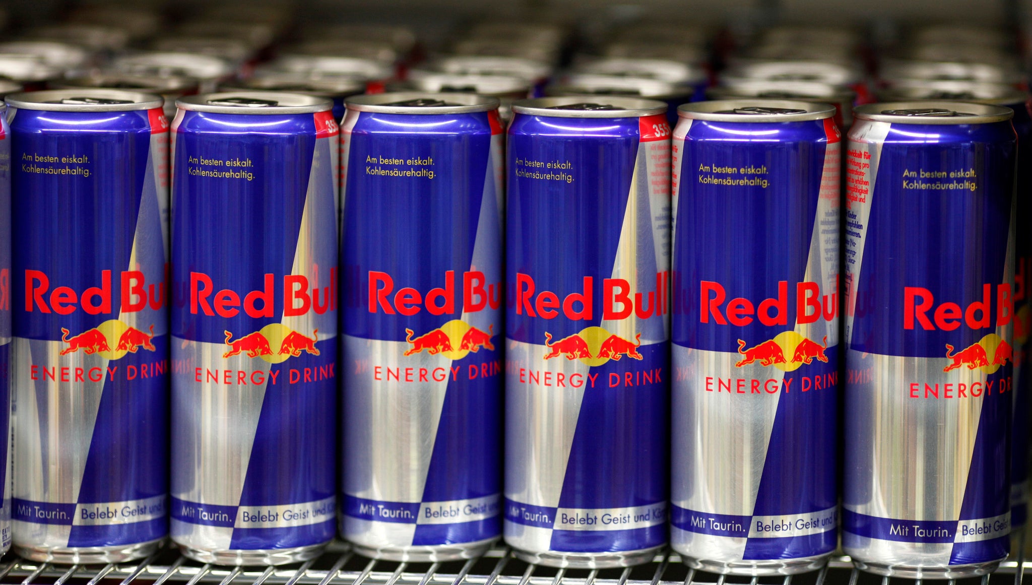 Cans of Red Bull are seen in a supermarket.