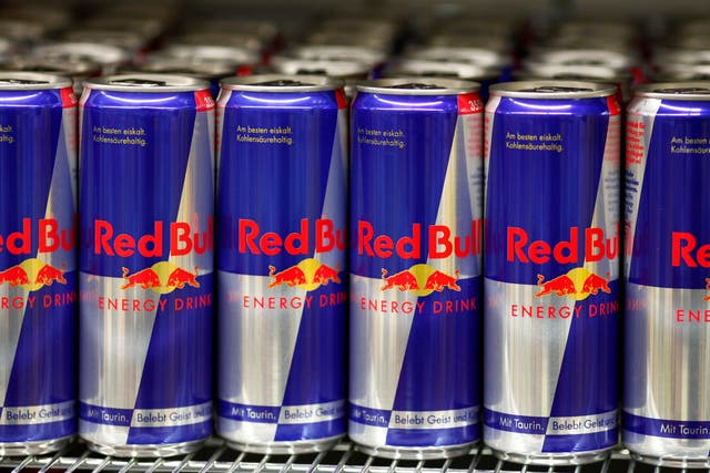 Cans of Red Bull are seen in a supermarket.