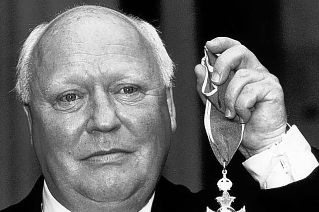 Hitchen receives his CBE in 1990; he later served on the Media Honours Committee