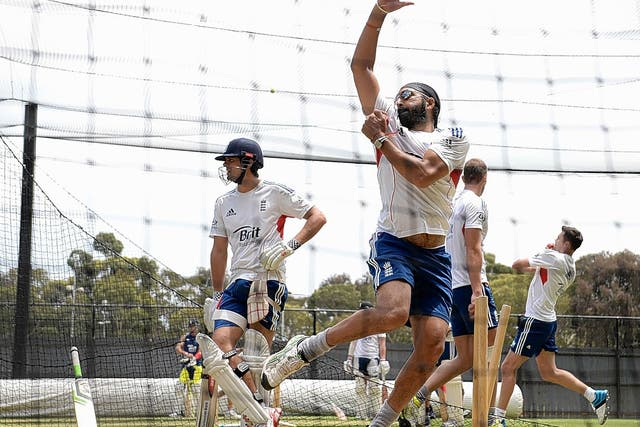 Monty Panesar bowls in the nets at Adelaide as Alastair Cook looks on