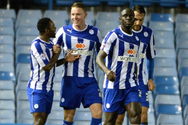 Sheffield Wednesday’s Connor Wickham (second left) scored both goals in the defeat of Leicester
