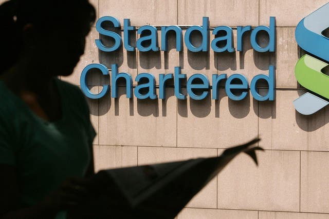 Standard Chartered has issued its first profit warning warns in a decade.