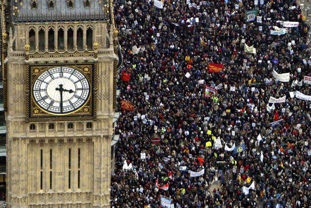 Several hundred thousand people march past the Westminster Clock Tower (Big Ben) towards Hyde Park to protest against the proposed war in Iraq February 15, 2003 in London