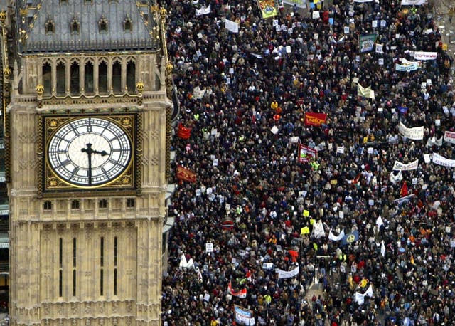 Several hundred thousand people march past the Westminster Clock Tower (Big Ben) towards Hyde Park to protest against the proposed war in Iraq February 15, 2003 in London