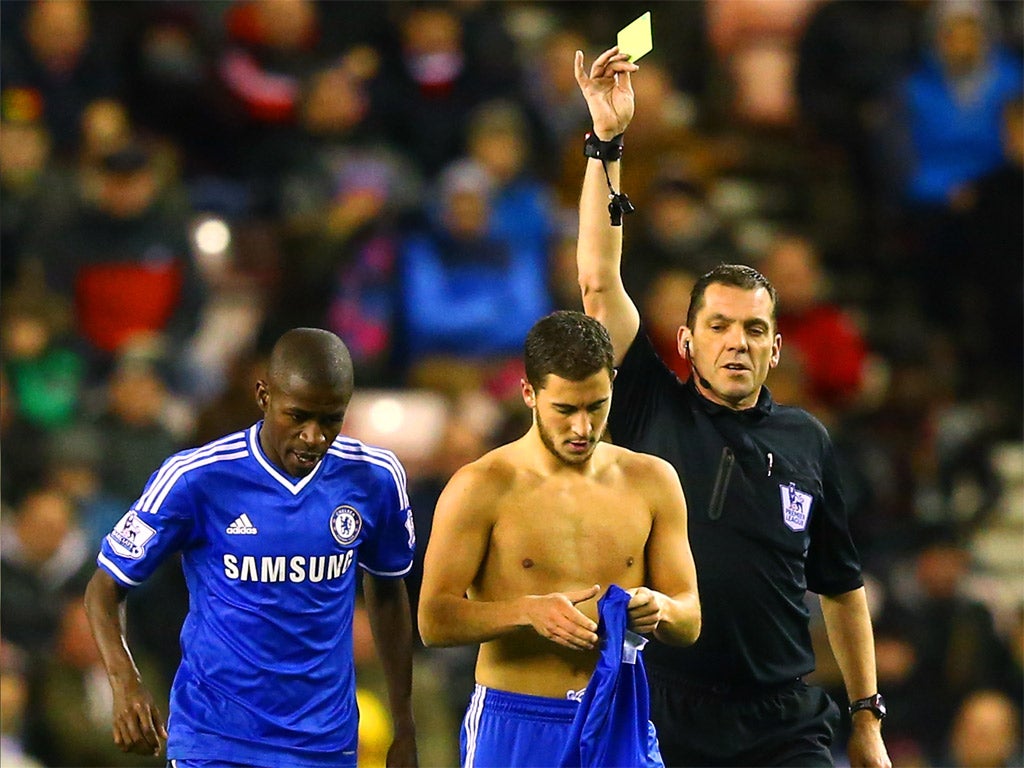 Hazard receives a yellow card for his topless celebration