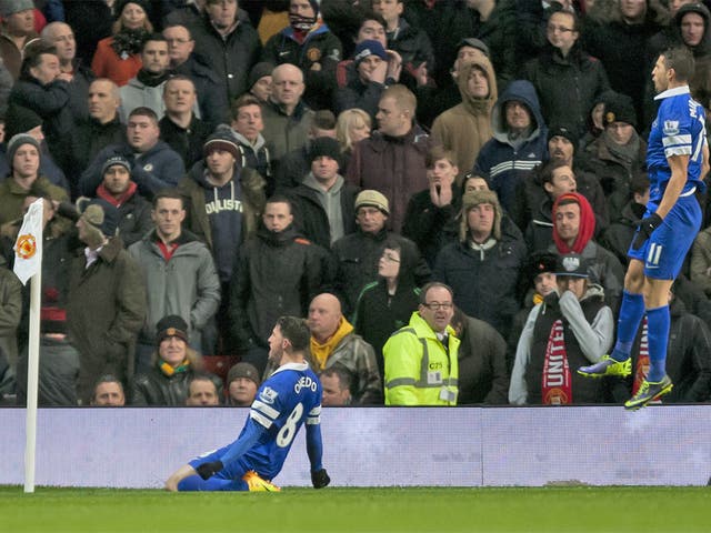 Brian Oviedo slides in front on the corner flag as he celebrates his dramatic late goal