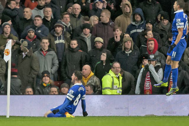 Brian Oviedo slides in front on the corner flag as he celebrates his dramatic late goal