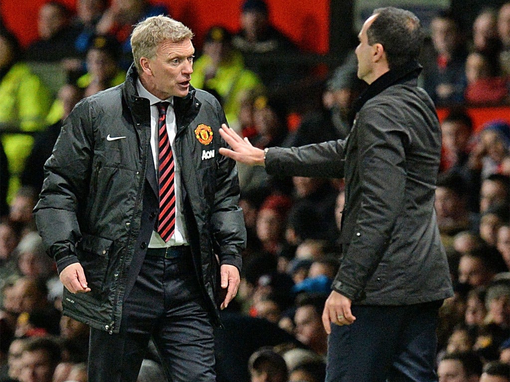 David Moyes and Roberto Martinez exchange views on the sideline