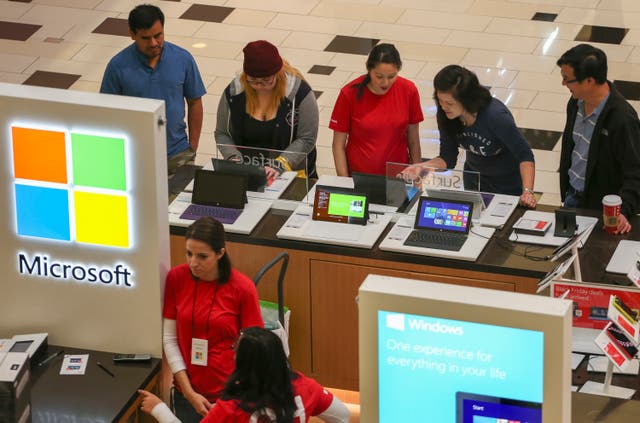 Black Friday shoppers check out Microsoft Surface tablets at the Glendale Galleria in Glendale, California November 29, 2013