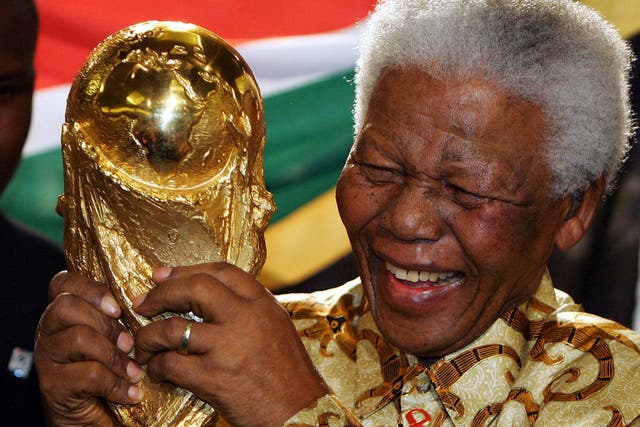 Nelson Mandela with the World Cup in 2010