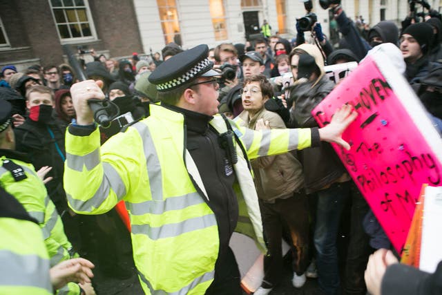 Police clash with student protesters at the University of London yesterday