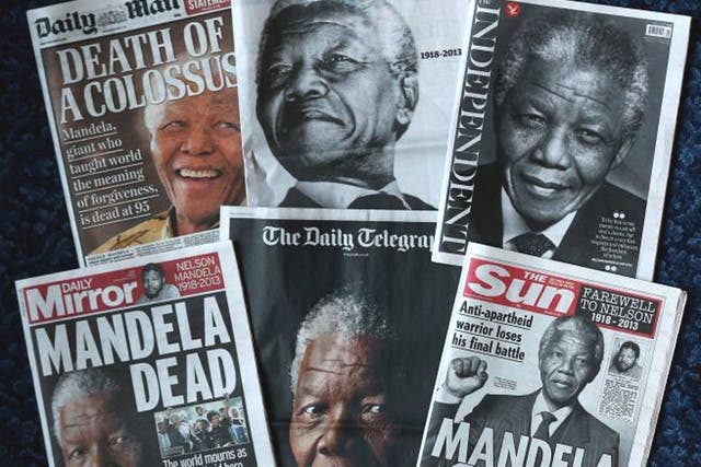 The front pages of British newspapers report on the death of former South African President Nelson Mandela in London, England