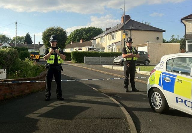 Police officers at the scene of the murder