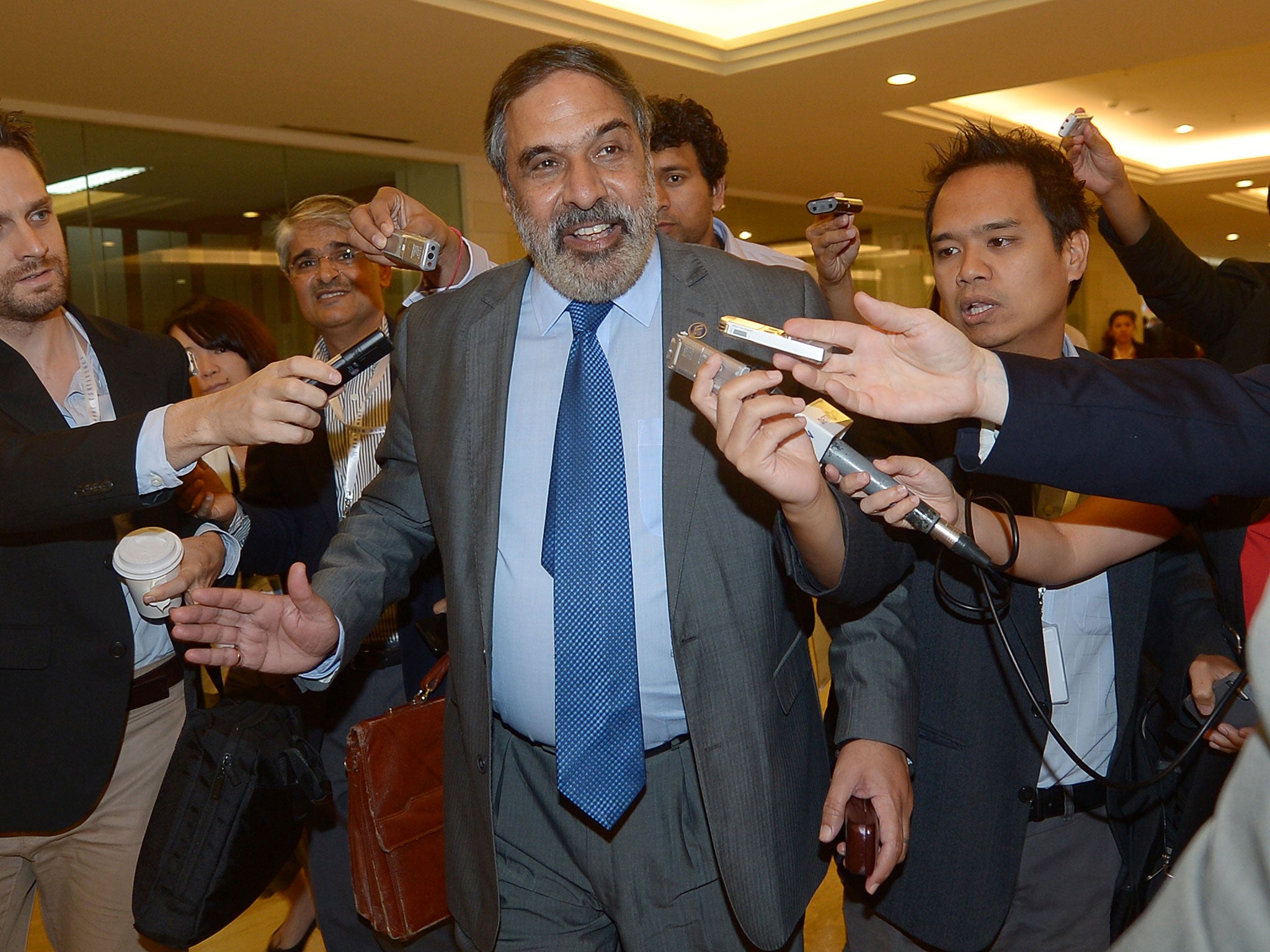 India's Minister of Commerce and Industry Shri Anand Sharma (C) arrives at the venue of the 9th World Trade Organization (WTO) Ministerial Conference in Nusa Dua, on the island of Bal