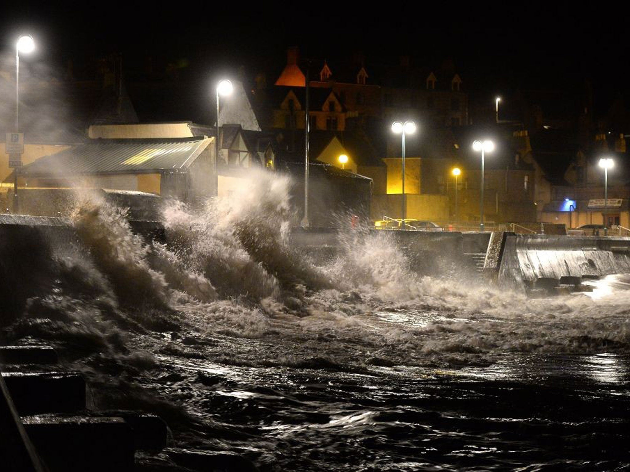 Huge waves pound Eyemouth harbour in Scotland during the storm surge