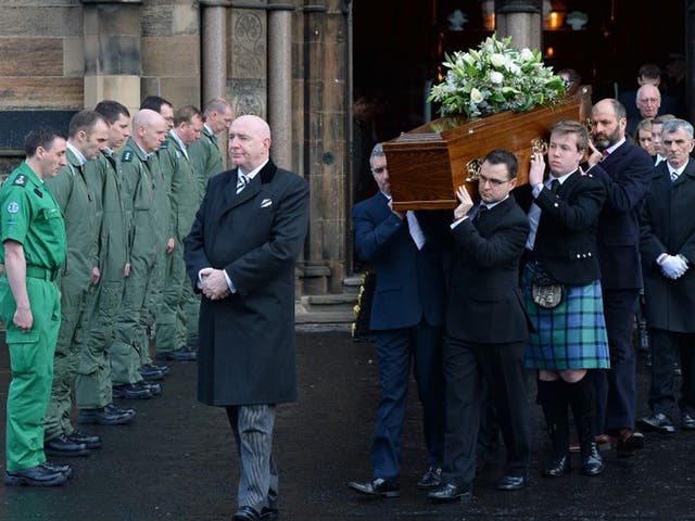 The body of David Traill is carried from the funeral service at the University of Glasgow's Bute Hall