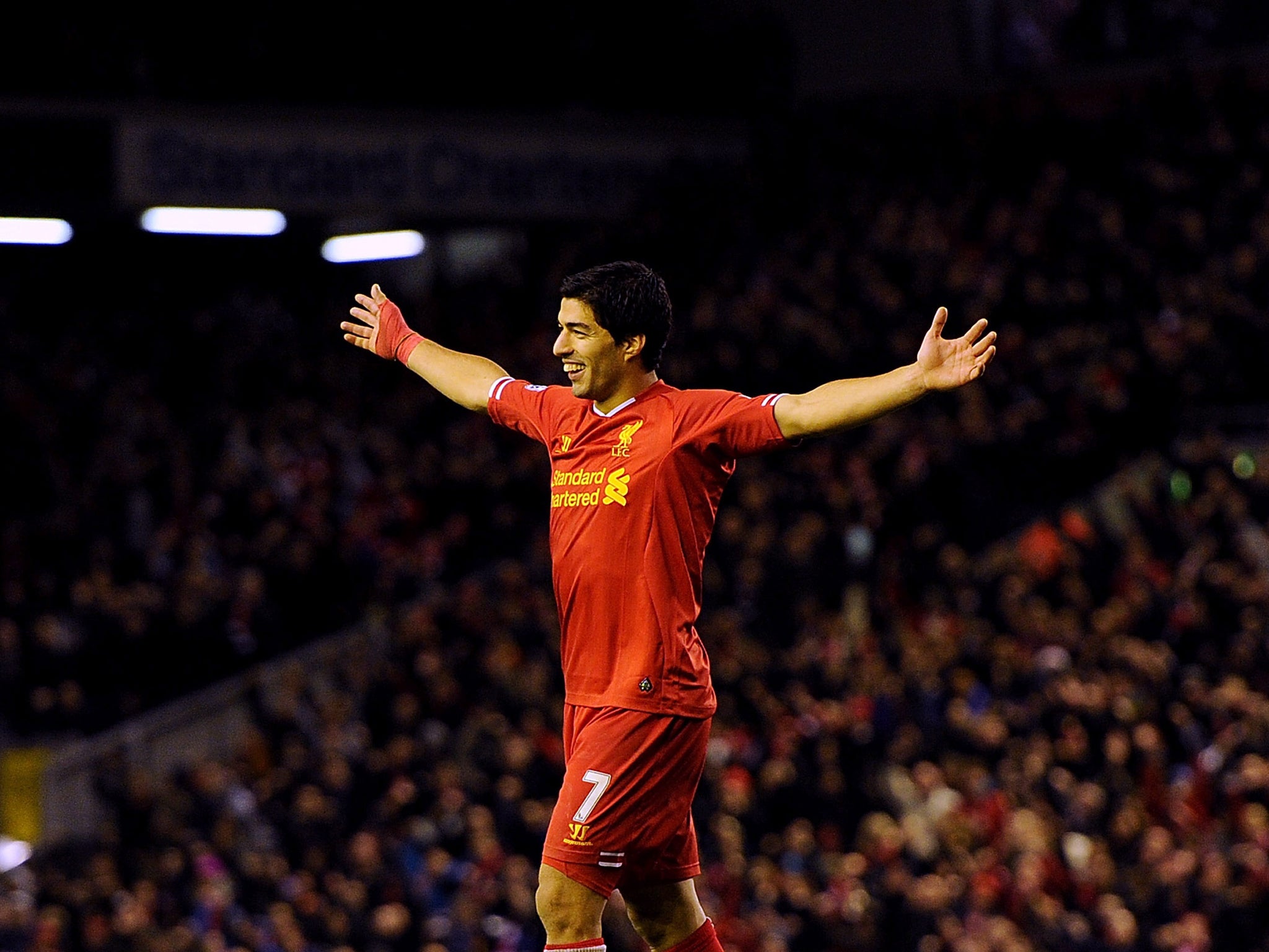 Luis Suarez celebrates after scoring against West Ham for Liverpool