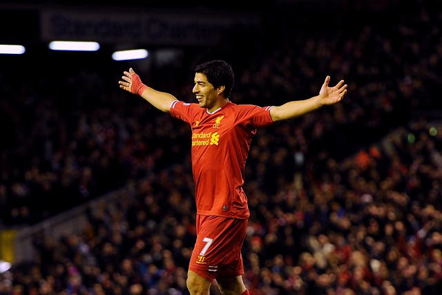 Luis Suarez celebrates after scoring against West Ham for Liverpool
