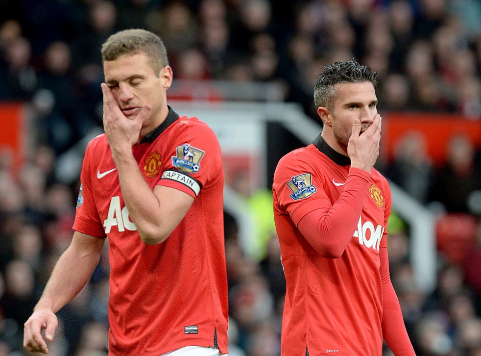Nemanja Vidic (left) and Robin van Persie react with dismay as Manchester United lose at home again