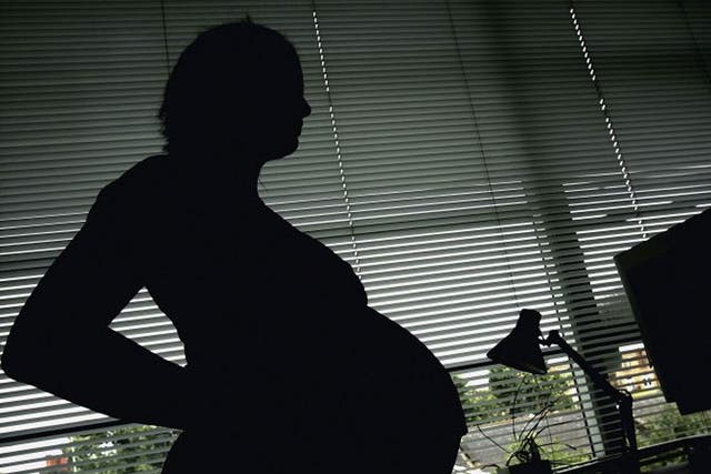 A heavily pregnant immigrant thought to be carrying a dead, unborn child was too afraid to seek medical help in the UK 