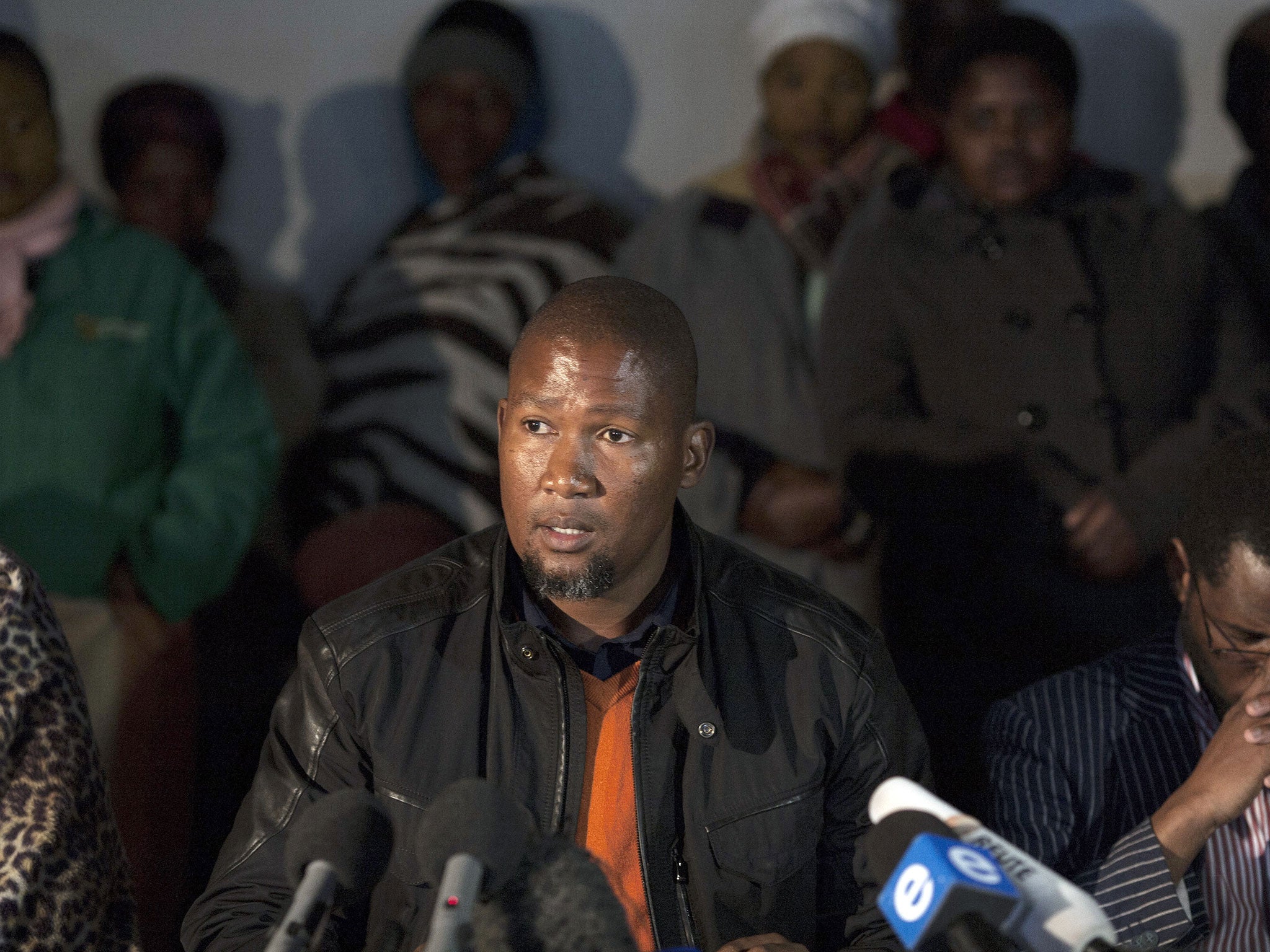 Tangled lives: Mandla Mandela speaking at a press conference on his his grandfather's health earlier in the year