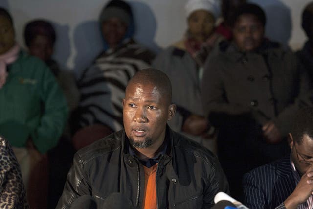 Tangled lives: Mandla Mandela speaking at a press conference on his his grandfather's health earlier in the year