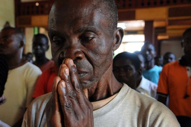 A man prays in St Paul’s Cathedral, Bangui yesterday 
