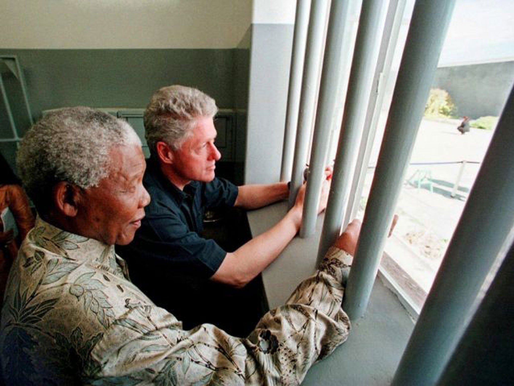 Mandela with Bill Clinton on the island where he was imprisoned