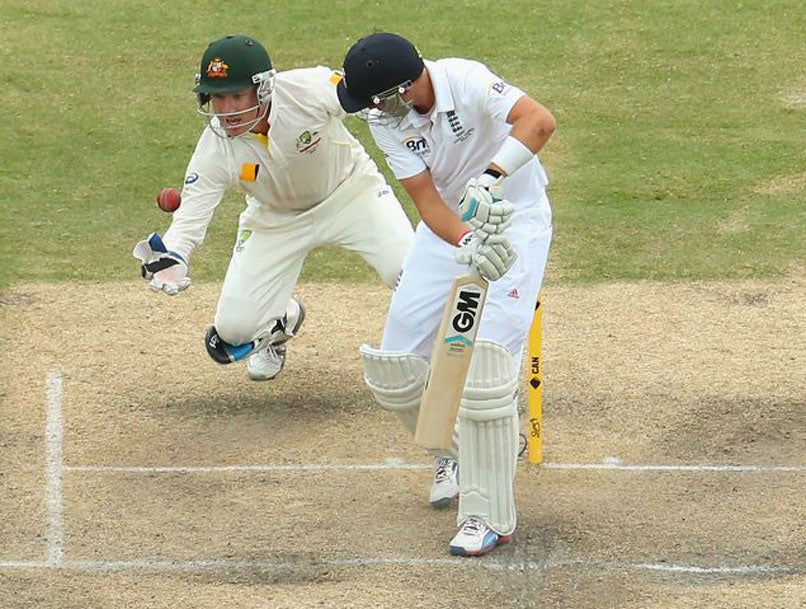 Australia wicketkeeper Brad Haddin takes a catch to dismiss Joe Root