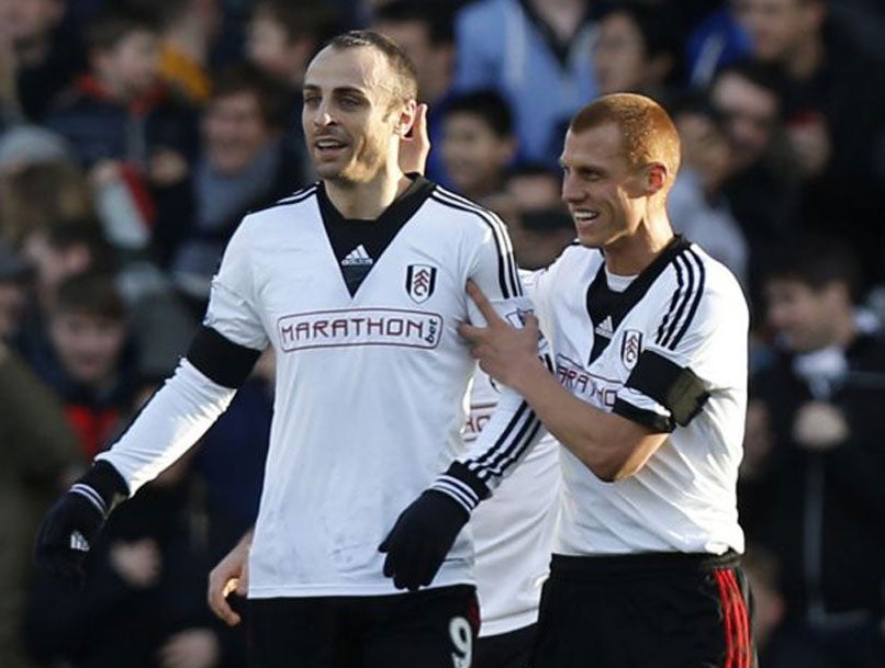 Dimitar Berbatov (left) celebrates his goal with Steve Sidwell, who had opened the scoring