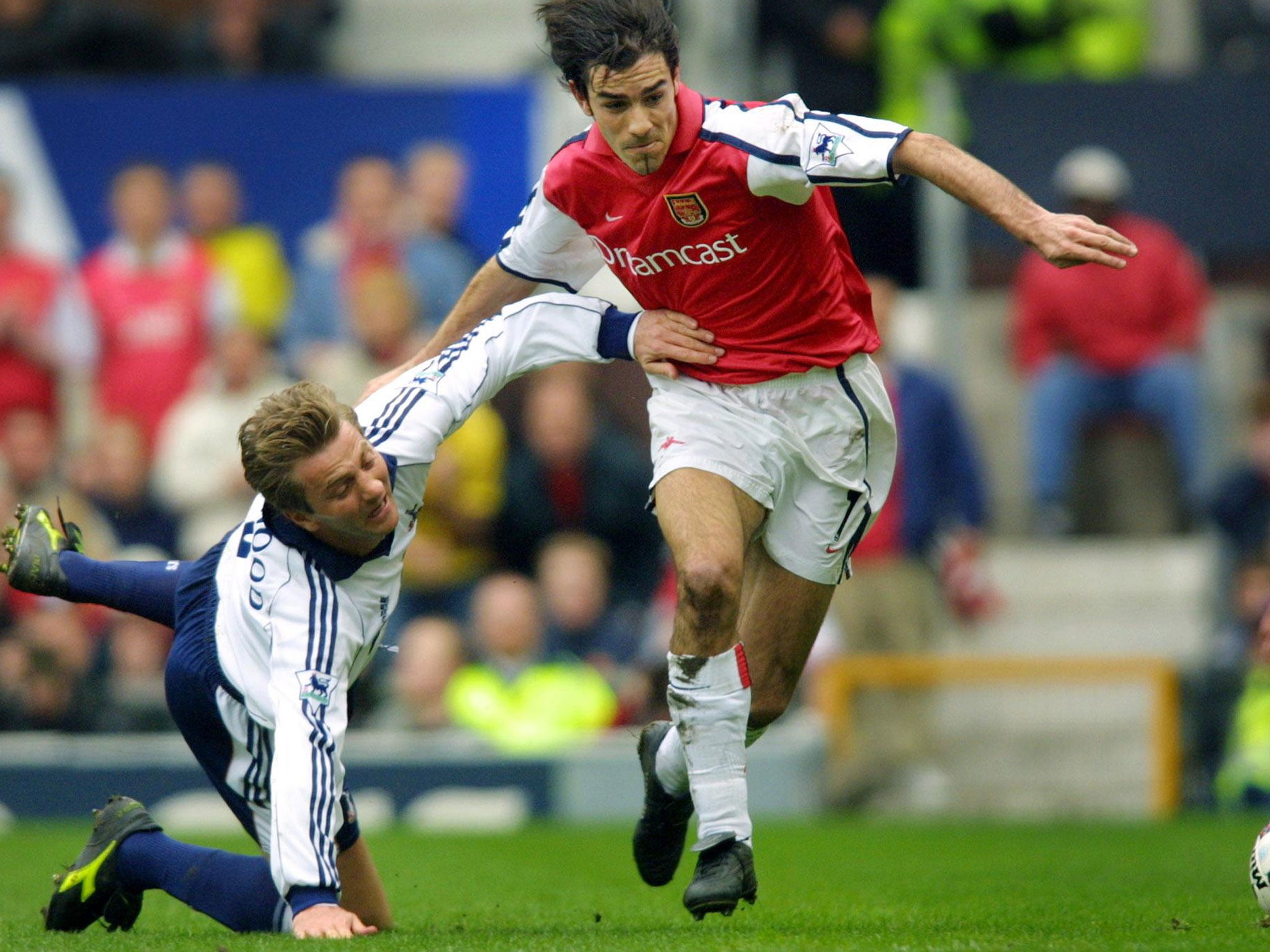 Arsenal's Frenchman Robert Pires (right) shrugs off Tottenham's Tim Sherwood during the FA Cup semi-final at Old Trafford in April 2001