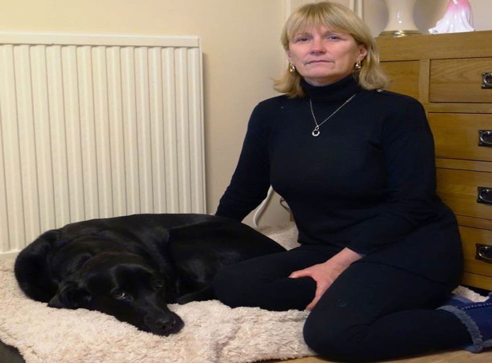 Julie Rees and her guide dog, Gwen, after the animal was brutally attacked and injured just yards from her home in Fforestfach, Swansea