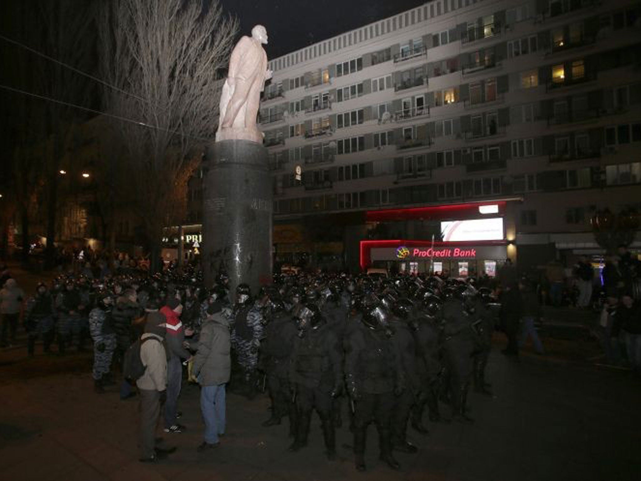 The statue has been the target of protests in recent weeks, and can be seen heavily defended in this picture from 1 December