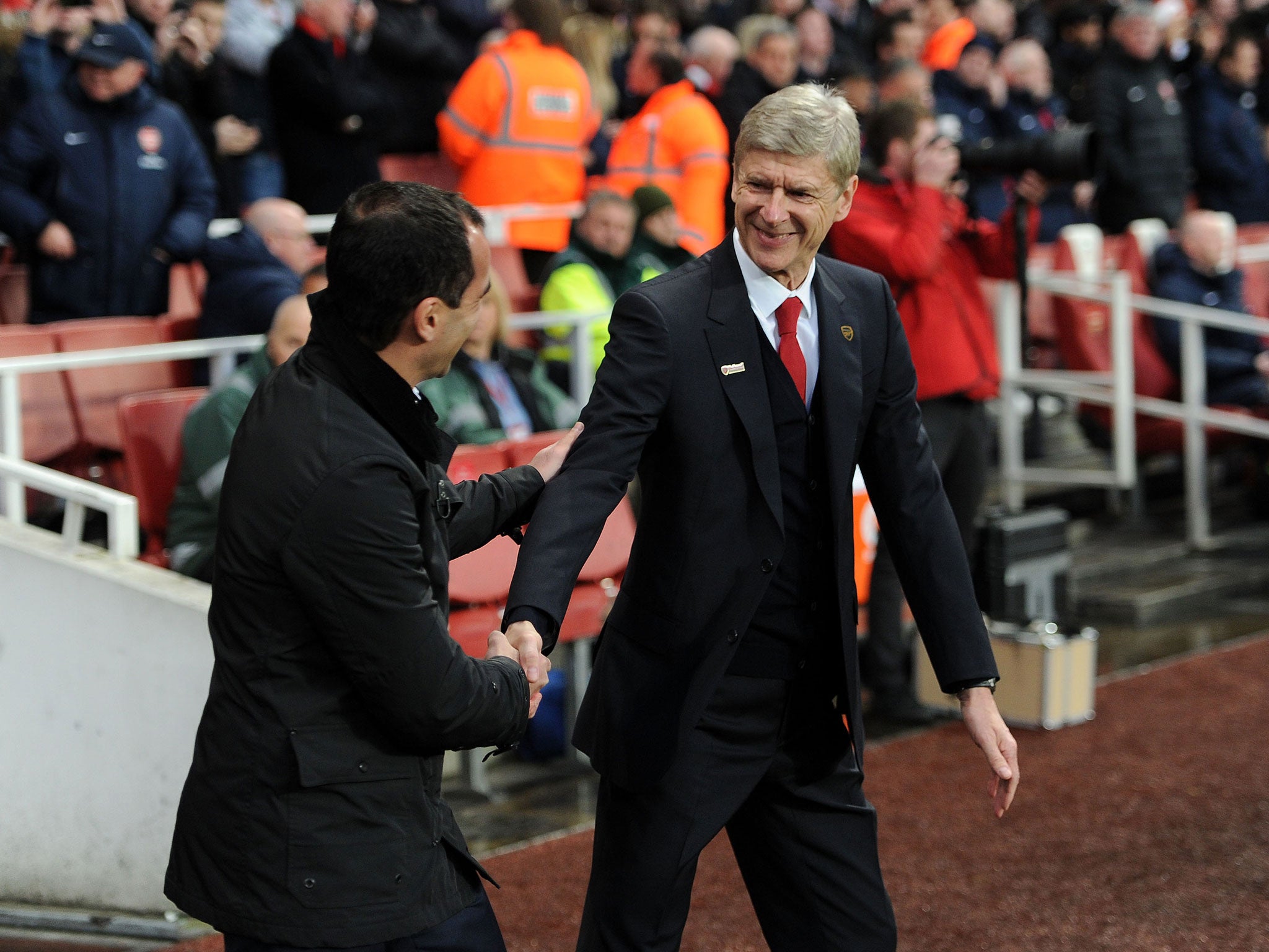 Everton manager Roberto Martinez and Arsenal boss Arsene Wenger shake hands ahead of the Premier League clash at the Emirates