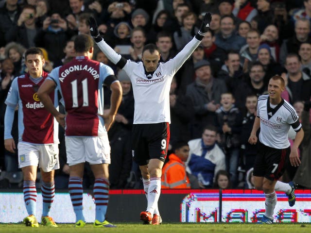 Fulham striker Dimitar Berbatov celebrates after scoring a penalty against Aston Villa