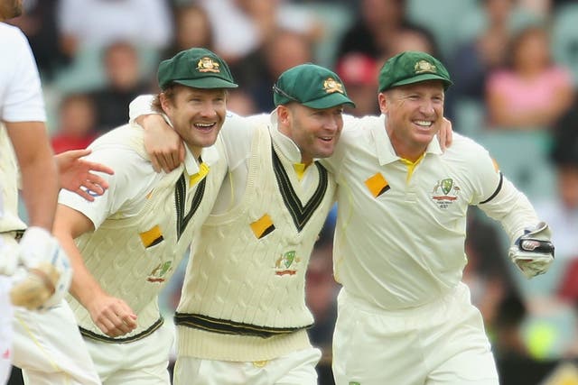 Australia captain Michael Clarke (C) celebrates with Shane Watson (L) and Brad Haddin (R) after victory over England in the Ashes Second Test
