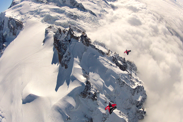 Espen Fadnes and Jokke Sommer descending to fly under the bridge at the top of Aiguille du Midi, 4,000m above Chamonix, France