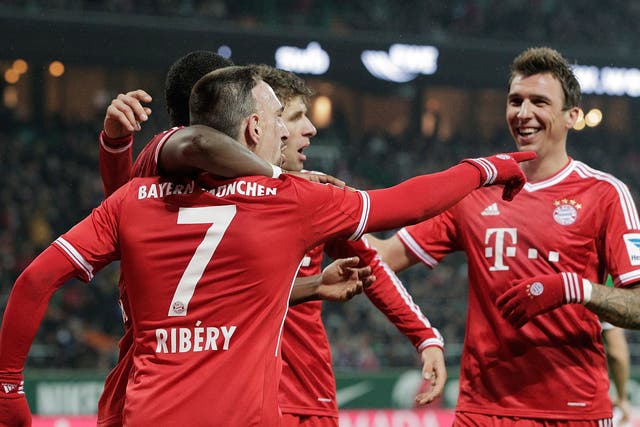 Bayern Munich winger Franck Ribery is congratulated by team-mates after scoring during the Bundesliga match against Werder Bremen on Saturday