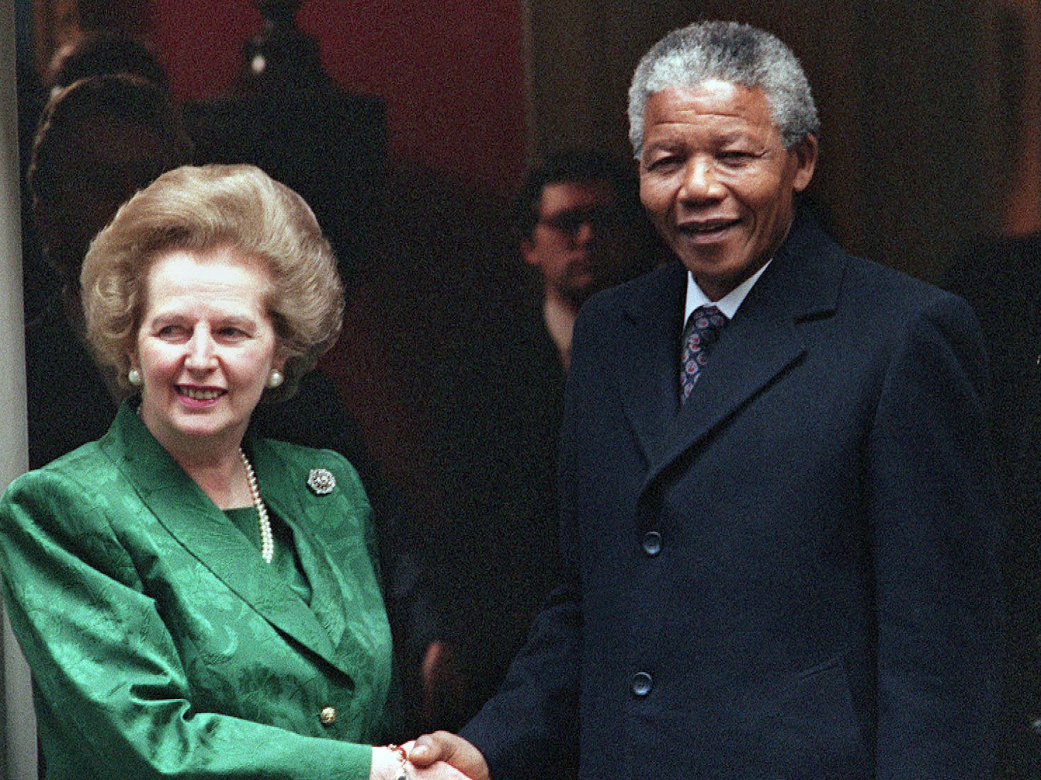 Thatcher, pictured with Mandela in 1990, viewed the ANC as revolutionary socialists