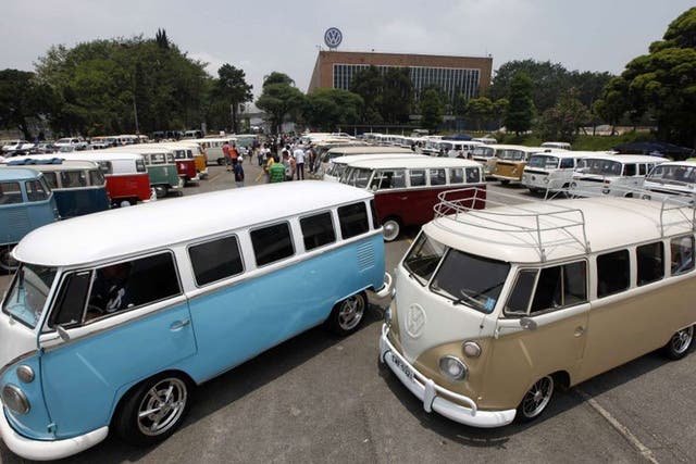 Various models of Volkswagen's Kombi minibus are displayed during a Kombi fan club meeting in Sao Bernardo do Campo, Brazil