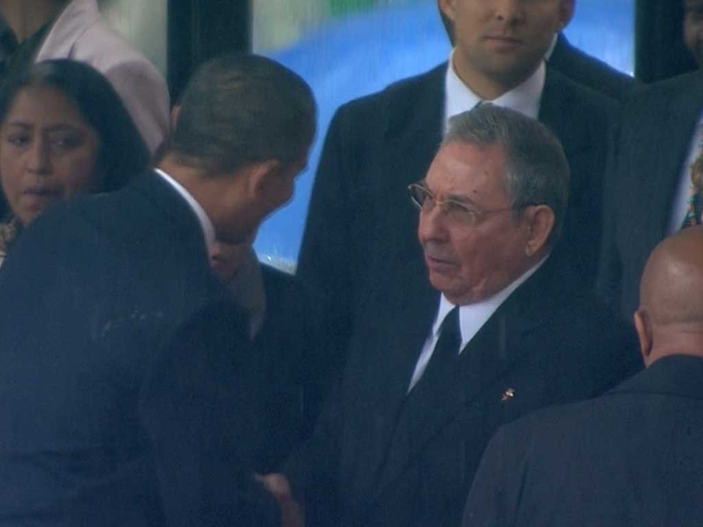 US President Barack Obama (left) shakes hands with Cuban President Raul Castro