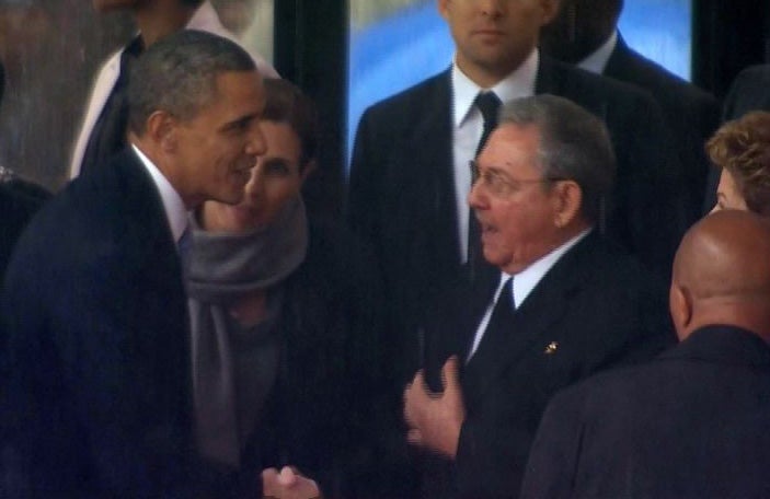 In this image from TV, US President Barack Obama shakes hands with Cuban President Raul Castro at the FNB Stadium in Soweto, South Africa, at the memorial service for former South African President Nelson Mandela